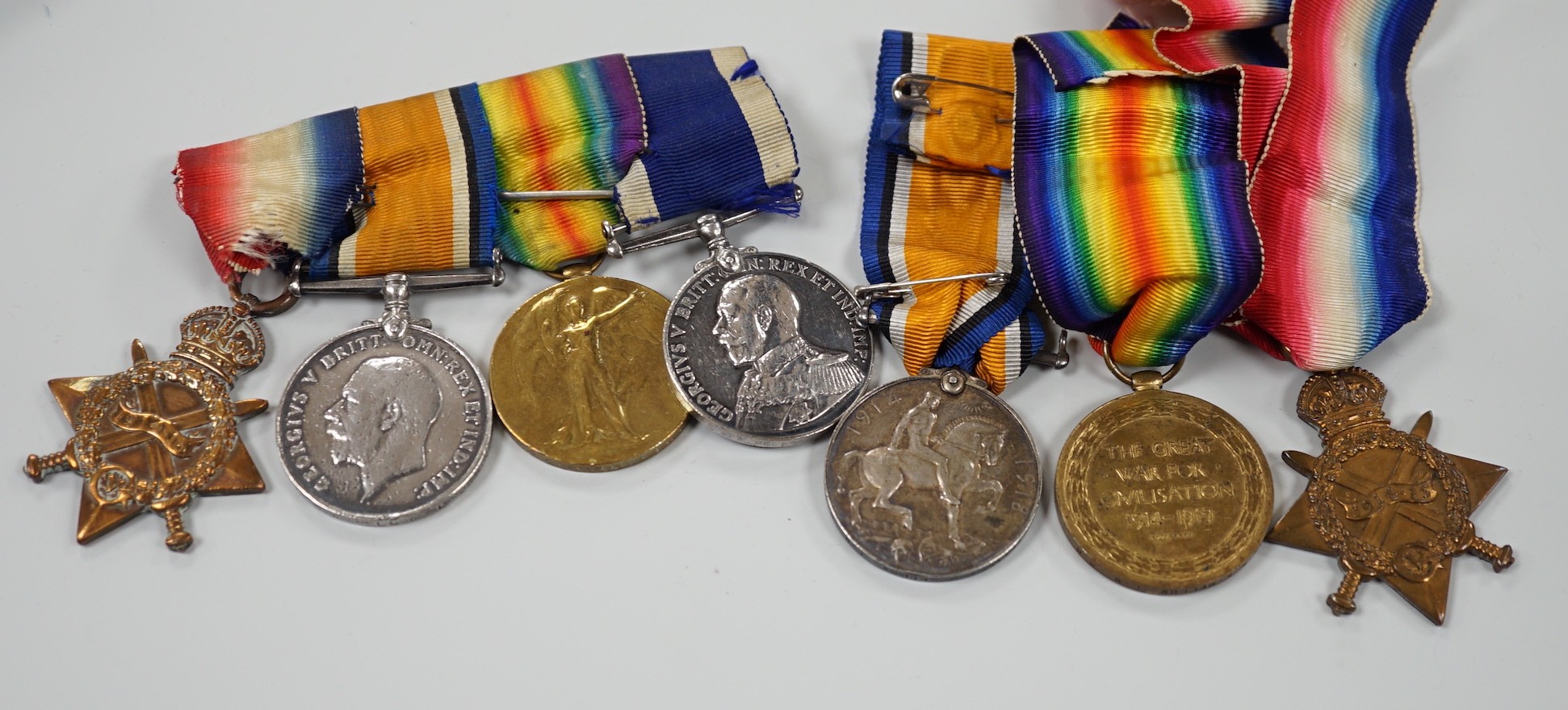 A WWI naval medal group of four with portrait photo with records and one other WWI trio